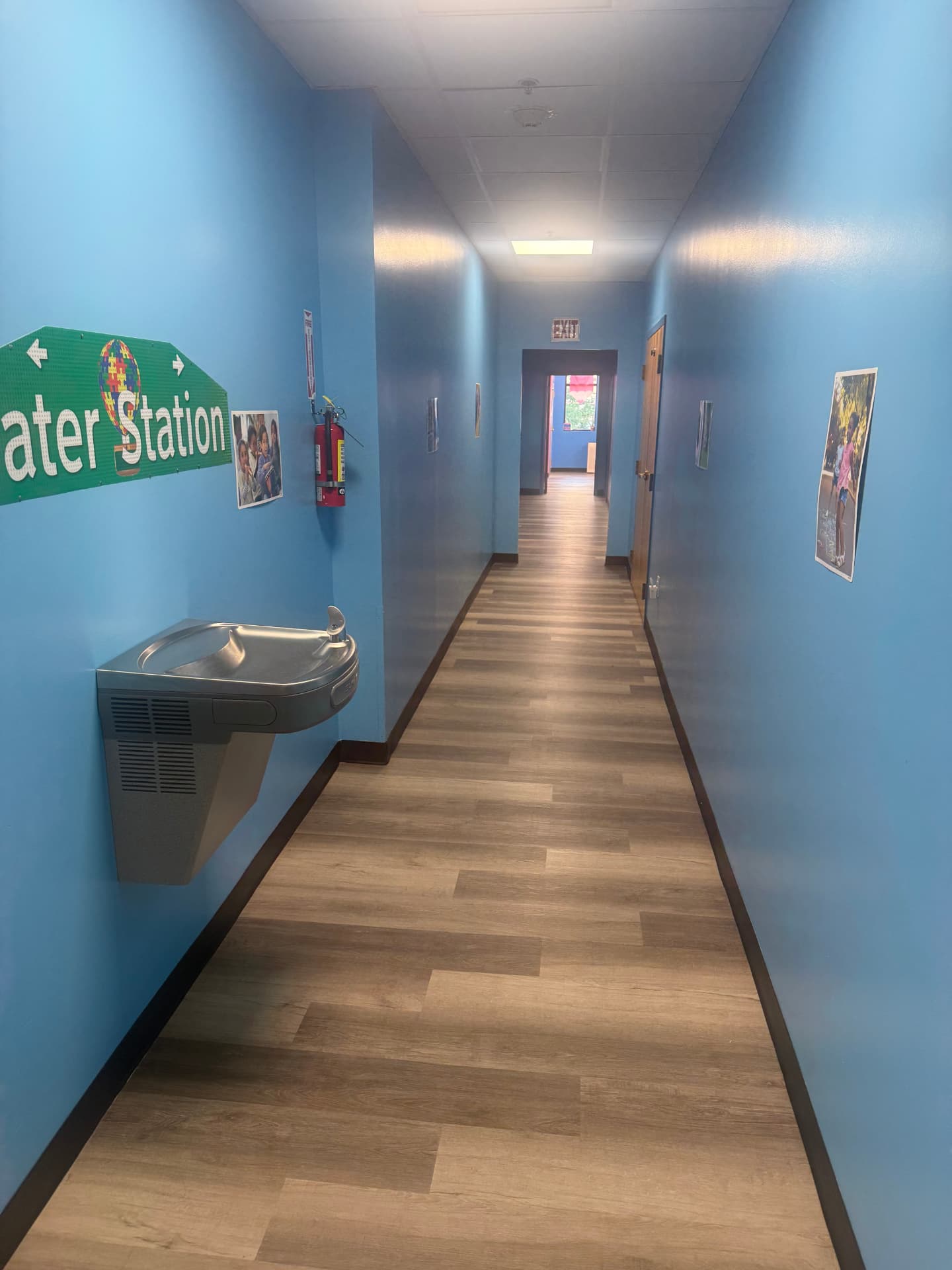 Clean hallway with water station signage